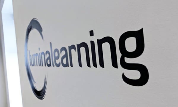 lumina learning logo office wall